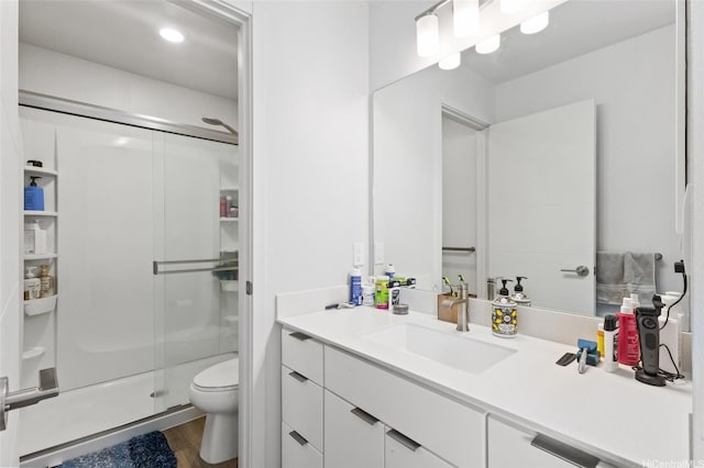 91-1640 Honouliuli St Unit 82, Ewa Beach, HI 96706 - full bathroom featuring vanity, a stall shower, and wood finished floors