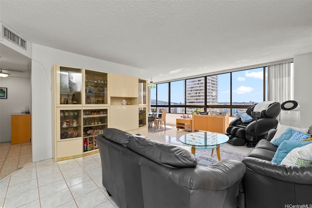 2499 Kapiolani Blvd Unit 2109, Honolulu, HI 96826 - living area with light tile patterned floors, a textured ceiling, and a city view