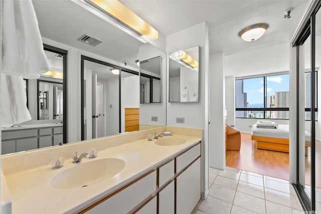 2499 Kapiolani Blvd Unit 2109, Honolulu, HI 96826 - bathroom with double vanity and tile patterned flooring