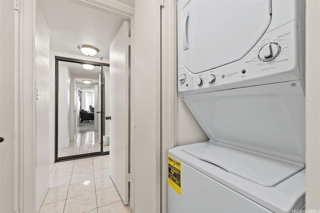 2499 Kapiolani Blvd Unit 2109, Honolulu, HI 96826 - washroom with stacked washing machine and dryer and light tile patterned floors