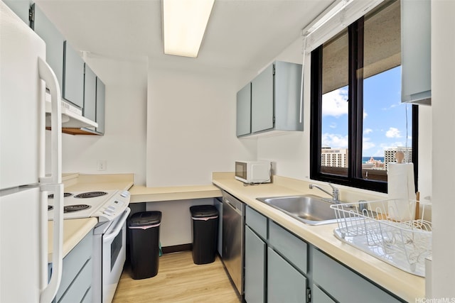 2121 Ala Wai Blvd Unit 1902, Honolulu, HI 96815 - kitchen with white appliances, gray cabinetry, light wood-style floors, and light countertops