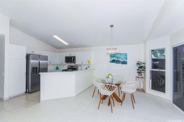 91-196 Wailohia Pl, Ewa Beach, HI 96706 - kitchen featuring appliances with stainless steel finishes, vaulted ceiling, a peninsula, light countertops, and decorative light fixtures