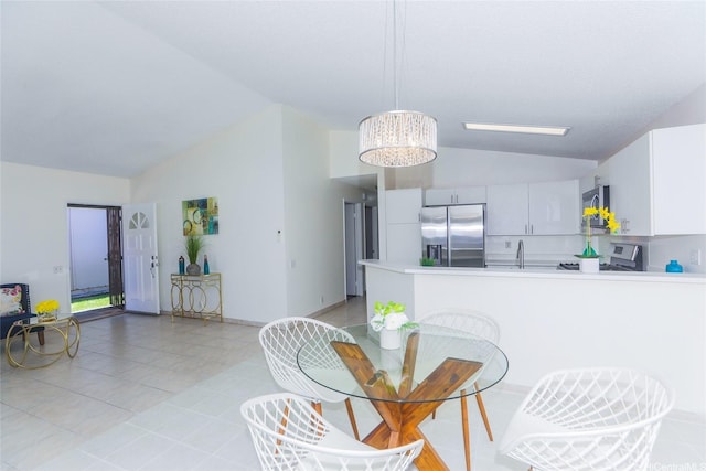 91-196 Wailohia Pl, Ewa Beach, HI 96706 - dining space with vaulted ceiling, light tile patterned floors, and a chandelier