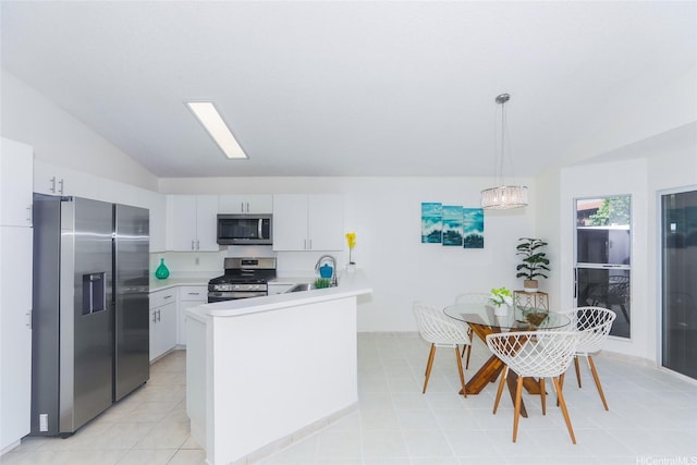 91-196 Wailohia Pl, Ewa Beach, HI 96706 - kitchen with stainless steel appliances, lofted ceiling, light countertops, a peninsula, and decorative light fixtures