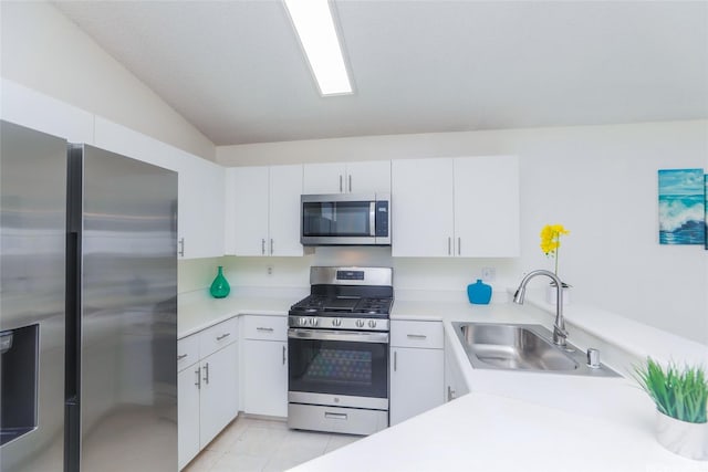 91-196 Wailohia Pl, Ewa Beach, HI 96706 - kitchen featuring stainless steel appliances, light countertops, vaulted ceiling, white cabinetry, and light tile patterned flooring