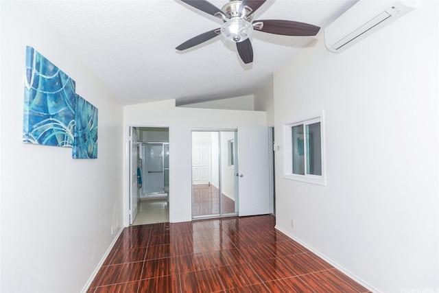 91-196 Wailohia Pl, Ewa Beach, HI 96706 - unfurnished bedroom featuring a wall mounted air conditioner, vaulted ceiling, a textured ceiling, and ceiling fan