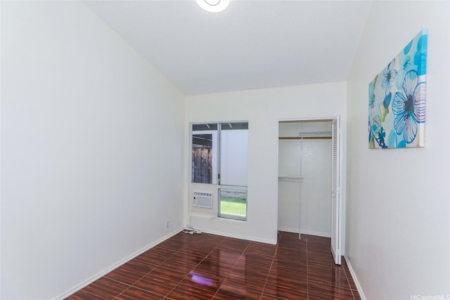 91-196 Wailohia Pl, Ewa Beach, HI 96706 - unfurnished bedroom with baseboards and a wall unit AC