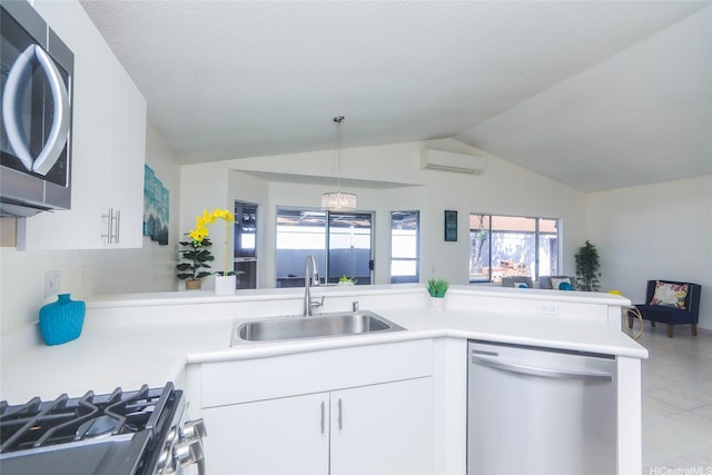 91-196 Wailohia Pl, Ewa Beach, HI 96706 - kitchen featuring appliances with stainless steel finishes, open floor plan, a wall mounted AC, light countertops, and lofted ceiling