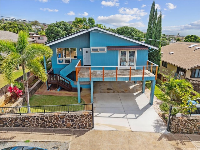 92-434 Kaiaulu St, Kapolei, HI 96707 - view of front of house featuring driveway, a fenced backyard, and a carport