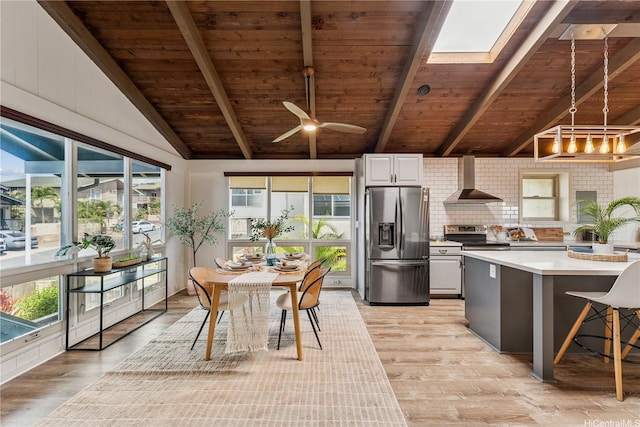 92-434 Kaiaulu St, Kapolei, HI 96707 - kitchen with appliances with stainless steel finishes, wall chimney exhaust hood, wooden ceiling, light countertops, and light wood-style flooring