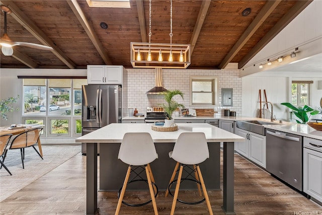 92-434 Kaiaulu St, Kapolei, HI 96707 - kitchen with stainless steel appliances, a wooden ceiling with exposed beams, light countertops, tasteful backsplash, and wall chimney range hood