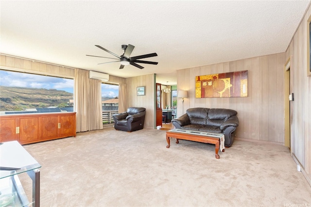 4692 Likini St, Honolulu, HI 96818 - carpeted living area with a wall mounted AC, a ceiling fan, wood walls, and a textured ceiling