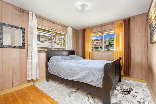 4692 Likini St, Honolulu, HI 96818 - bedroom featuring light wood-style floors and wooden walls