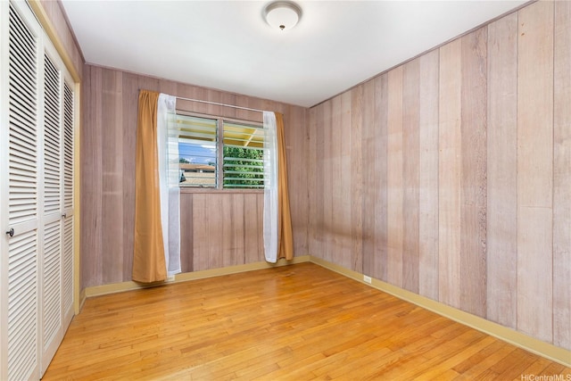 4692 Likini St, Honolulu, HI 96818 - spare room featuring wood finished floors and wooden walls