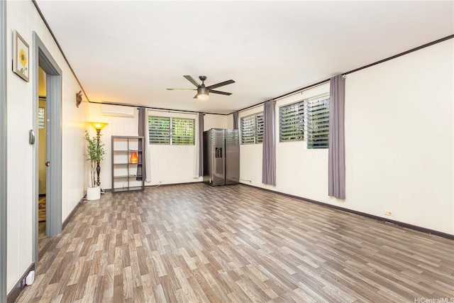 4692 Likini St, Honolulu, HI 96818 - unfurnished room with light wood finished floors, a ceiling fan, and an AC wall unit