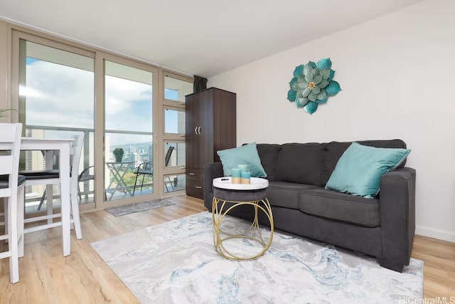 445 Seaside Ave Unit 3316, Honolulu, HI 96815 - living room featuring wood finished floors and a wall of windows