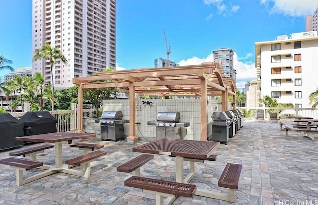 445 Seaside Ave Unit 3316, Honolulu, HI 96815 - view of patio / terrace featuring area for grilling, a pergola, and a city view