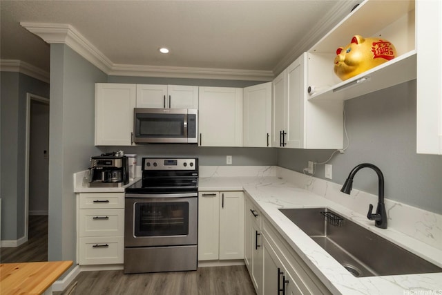 91-1097 Namahoe St Unit 4D, Kapolei, HI 96707 - kitchen featuring appliances with stainless steel finishes, dark wood finished floors, crown molding, white cabinetry, and light stone countertops
