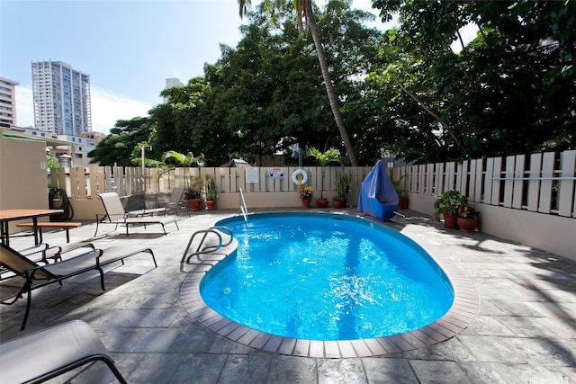 444 Kanekapolei St Unit 705, Honolulu, HI 96815 - view of pool with a fenced backyard, a patio, and a view of city