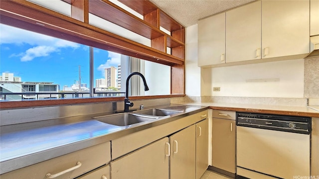 1310 Heulu St Unit 301, Honolulu, HI 96822 - kitchen with dishwasher, a city view, a textured ceiling, light countertops, and cream cabinets