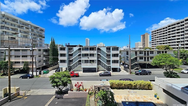 1310 Heulu St Unit 301, Honolulu, HI 96822 - view of apartment building / complex featuring a city view and uncovered parking