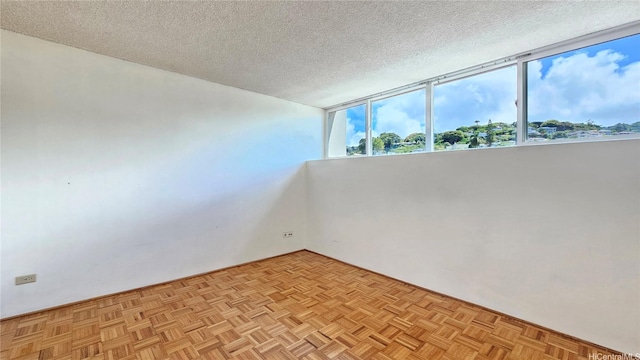 1310 Heulu St Unit 301, Honolulu, HI 96822 - spare room with a textured ceiling