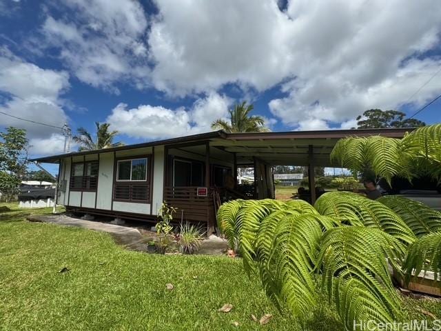 16-2033 Hibiscus Dr, Pahoa, HI 96778 - back of house featuring a lawn
