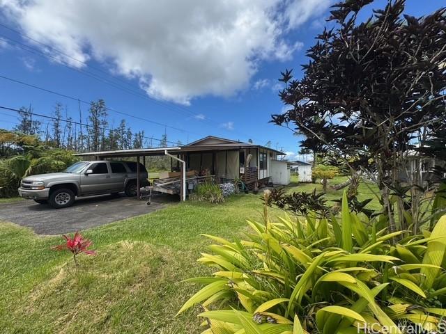 16-2033 Hibiscus Dr, Pahoa, HI 96778 - view of side of property featuring a yard