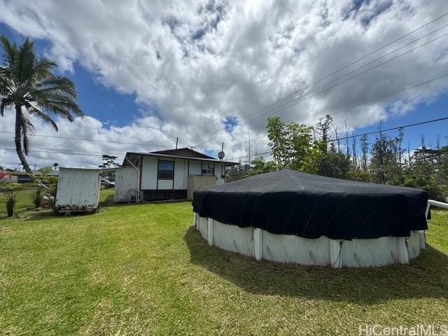 16-2033 Hibiscus Dr, Pahoa, HI 96778 - view of swimming pool with a lawn