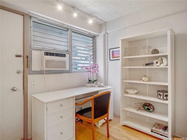 417 Nohonani St Unit 312, Honolulu, HI 96815 - office area with built in study area, light wood finished floors, a textured ceiling, and track lighting