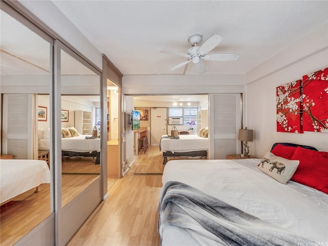 417 Nohonani St Unit 312, Honolulu, HI 96815 - bedroom featuring light wood-type flooring, a closet, cooling unit, and a ceiling fan