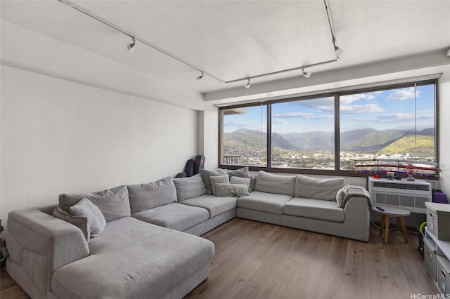 2333 Kapiolani Blvd Unit 3202, Honolulu, HI 96826 - living room featuring track lighting, a mountain view, and wood finished floors