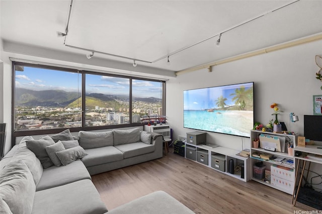 2333 Kapiolani Blvd Unit 3202, Honolulu, HI 96826 - living area featuring track lighting and wood finished floors