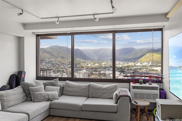 2333 Kapiolani Blvd Unit 3202, Honolulu, HI 96826 - living area with a mountain view, wood finished floors, track lighting, and healthy amount of natural light