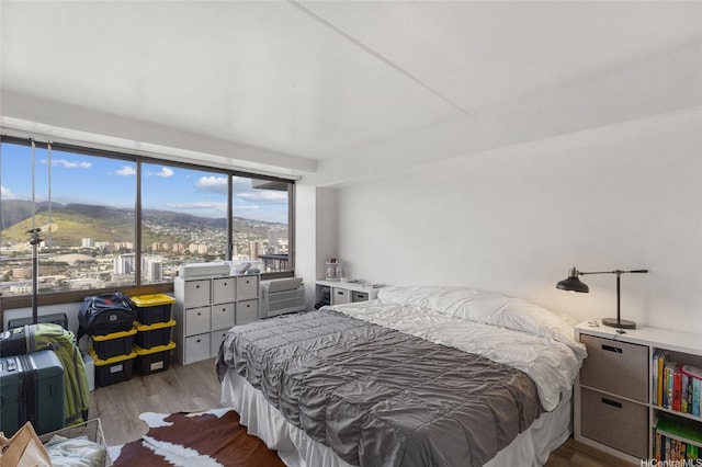 2333 Kapiolani Blvd Unit 3202, Honolulu, HI 96826 - bedroom featuring wood finished floors and a mountain view