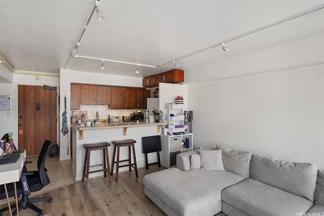 2333 Kapiolani Blvd Unit 3202, Honolulu, HI 96826 - living room featuring track lighting, light wood finished floors, and an office area