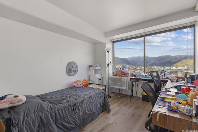 2333 Kapiolani Blvd Unit 3202, Honolulu, HI 96826 - bedroom with a mountain view, light wood-style floors, and multiple windows