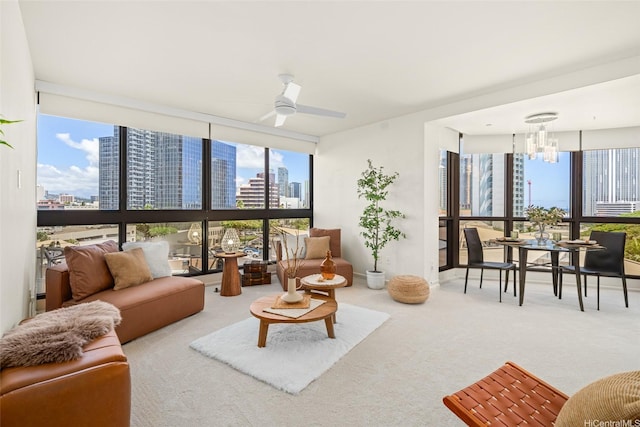 600 Queen St Unit 612, Honolulu, HI 96813 - living room featuring a skyline view, a chandelier, carpet flooring, ceiling fan, and floor to ceiling windows