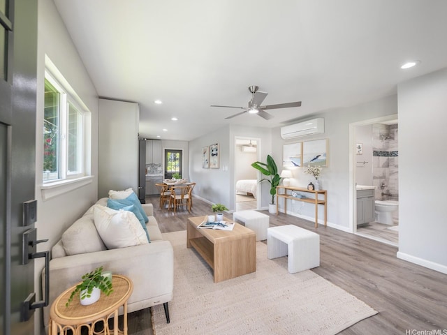 87-274 Saint Johns Rd Unit B, Waianae, HI 96792 - living room featuring a wall unit AC, plenty of natural light, light wood-type flooring, and recessed lighting