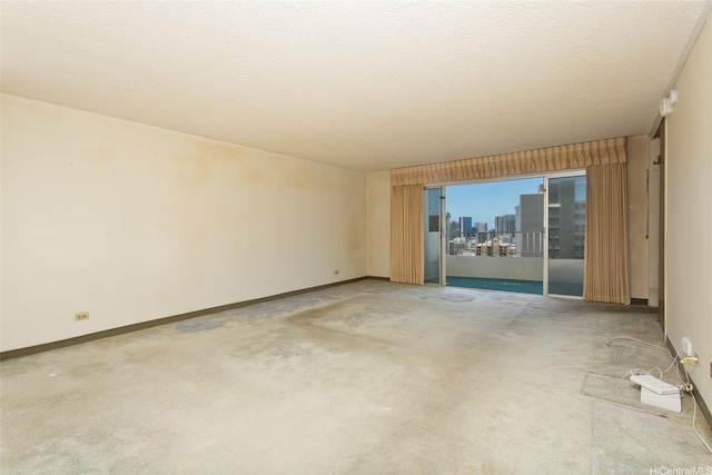 927 Prospect St Unit 606, Honolulu, HI 96822 - unfurnished room with carpet, a view of city, and a textured ceiling