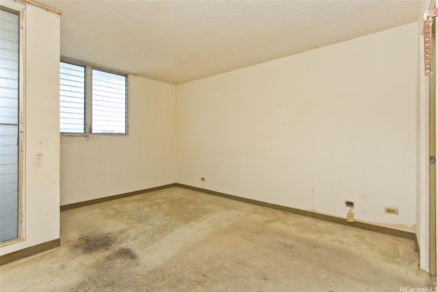 927 Prospect St Unit 606, Honolulu, HI 96822 - spare room with light colored carpet and a textured ceiling
