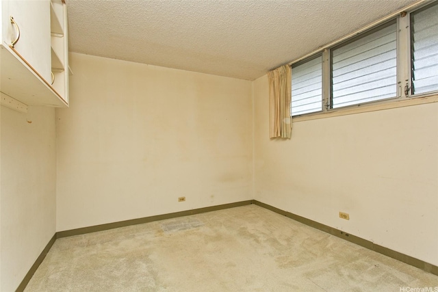 927 Prospect St Unit 606, Honolulu, HI 96822 - unfurnished room with light carpet and a textured ceiling