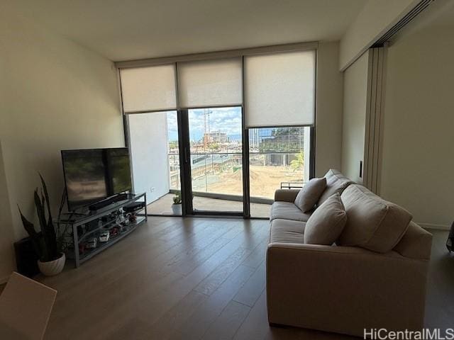 1000 Auahi St Unit 403, Honolulu, HI 96814 - living area with expansive windows, healthy amount of natural light, and wood finished floors