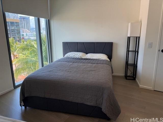 1000 Auahi St Unit 403, Honolulu, HI 96814 - bedroom featuring wood finished floors and baseboards
