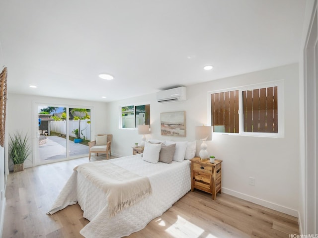45-343 Namoku St Unit 343, Kaneohe, HI 96744 - bedroom with an AC wall unit, access to exterior, wood finished floors, and recessed lighting