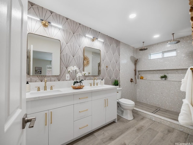 45-343 Namoku St Unit 343, Kaneohe, HI 96744 - full bath with double vanity, a tile shower, and wood finished floors