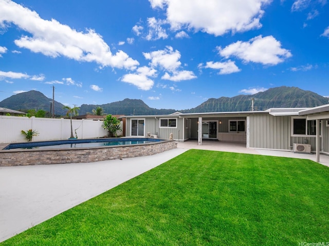 45-343 Namoku St Unit 343, Kaneohe, HI 96744 - rear view of property with a mountain view, board and batten siding, and a patio area