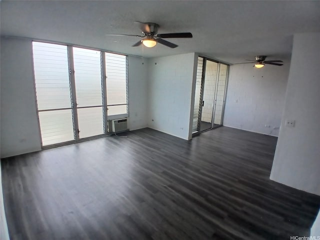750 Kanoa St Unit 305, Honolulu, HI 96817 - unfurnished living room with ceiling fan, dark wood-style flooring, and a wall mounted air conditioner