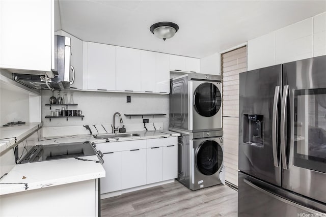 95-20 Waihonu St Unit C805, Mililani, HI 96789 - laundry area with stacked washer and clothes dryer and light wood-style floors