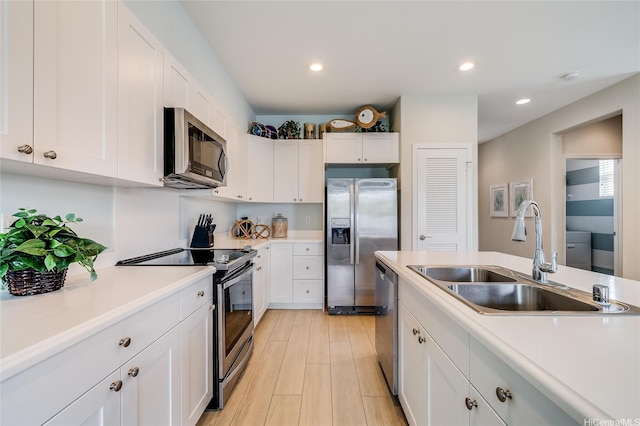 91-2220 Kaiwawalo St Unit 1001, Ewa Beach, HI 96706 - kitchen featuring appliances with stainless steel finishes, light countertops, white cabinets, and recessed lighting
